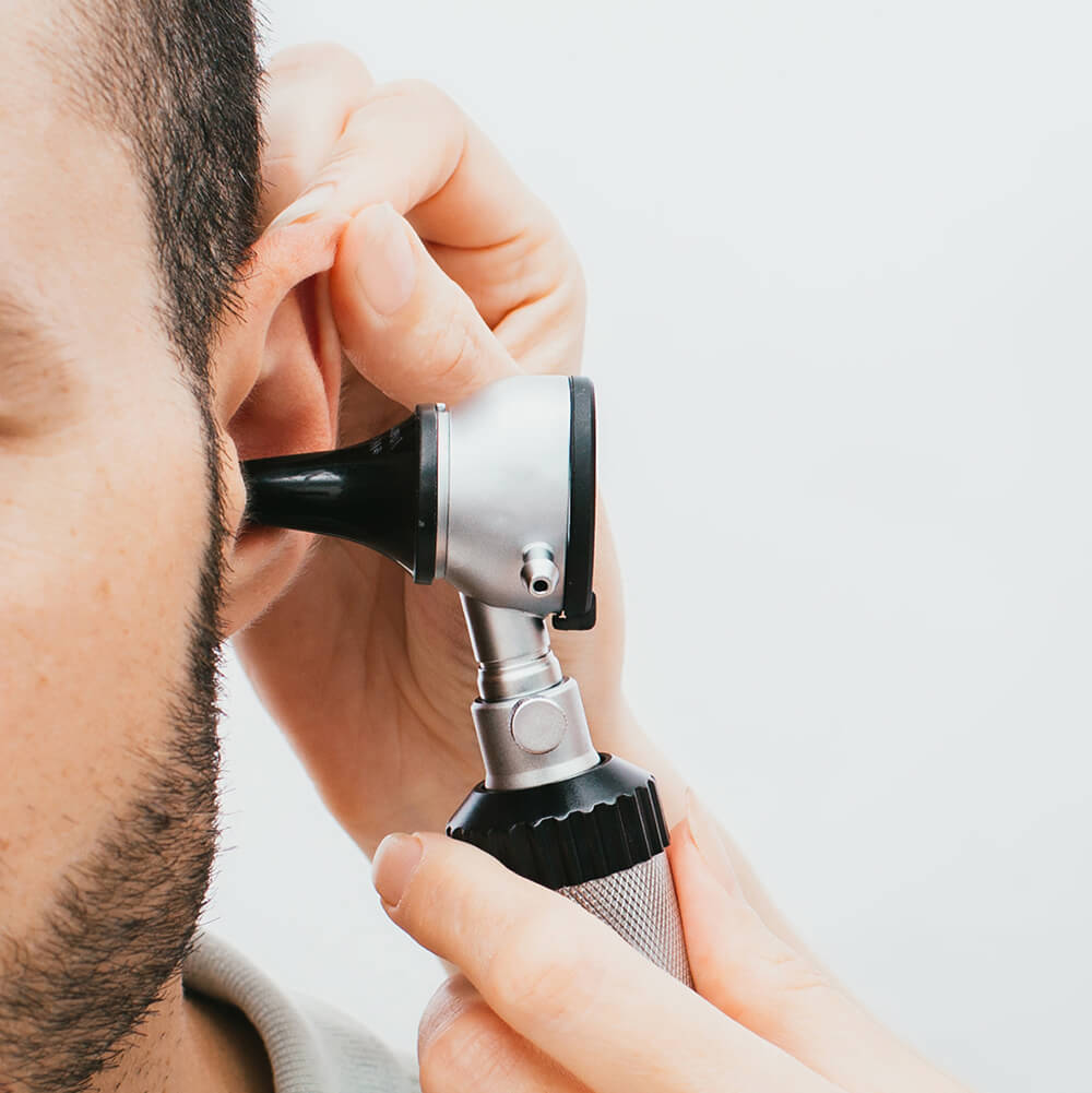 Audiologist Performing Hearing Evaluation